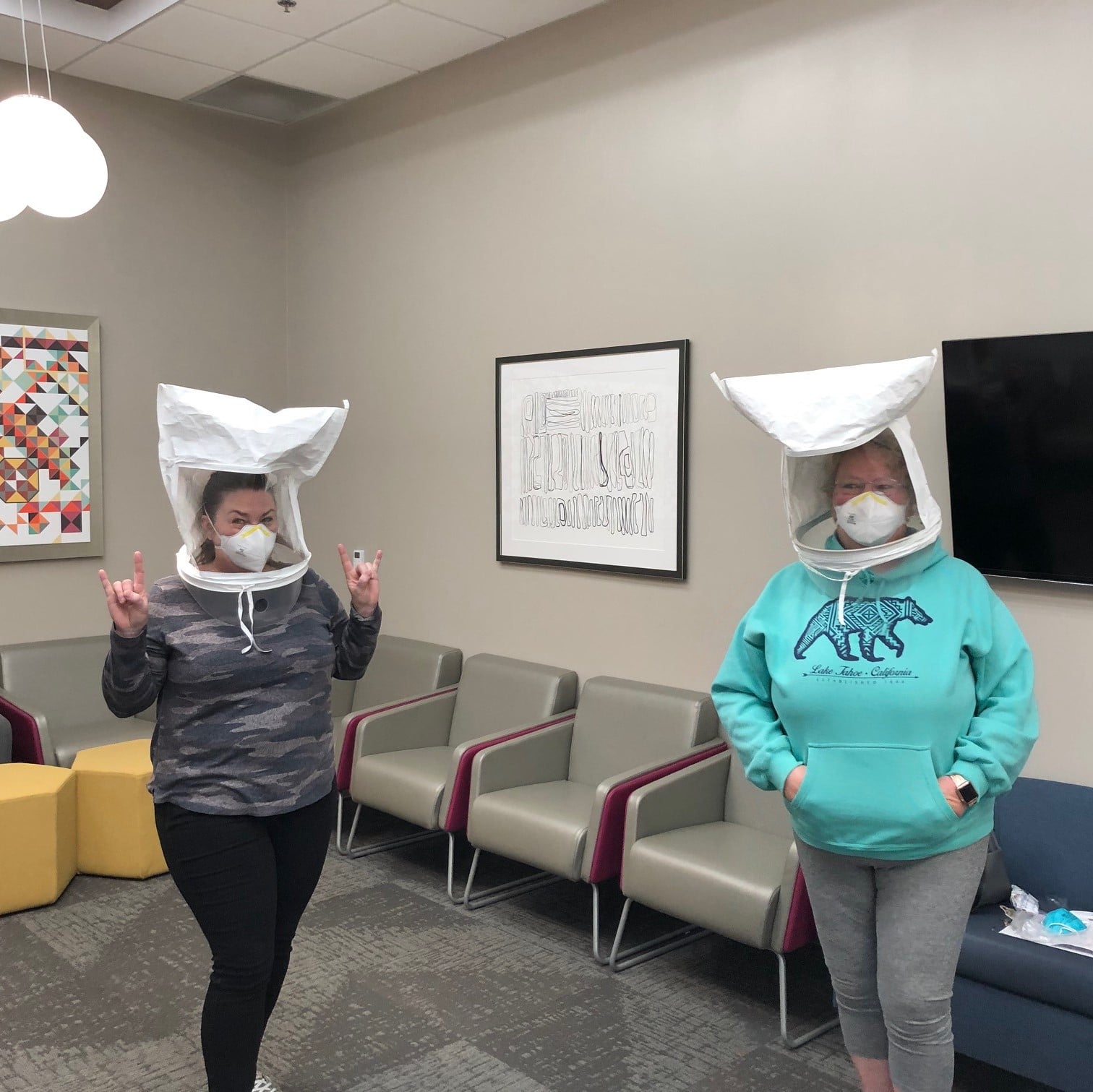 two women wearing covid-19 safety masks